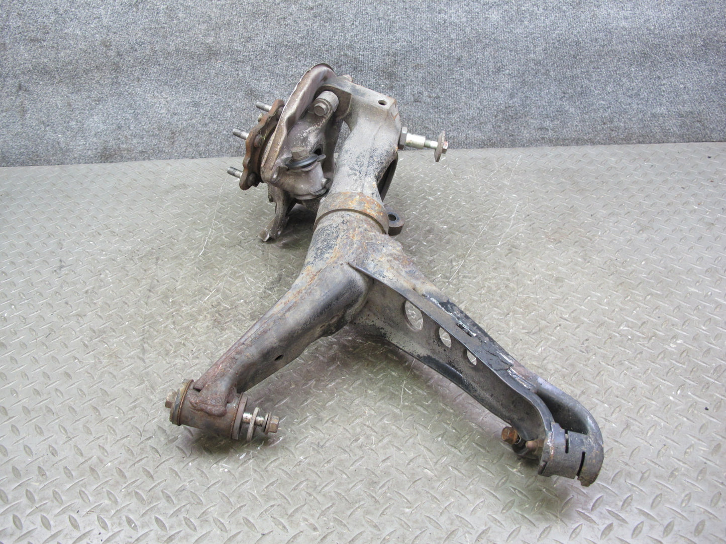 86-91 Mazda RX7 FC3S Rear Left Spindle Knuckle Wheel Hub w Trailing Arm Assy OEM