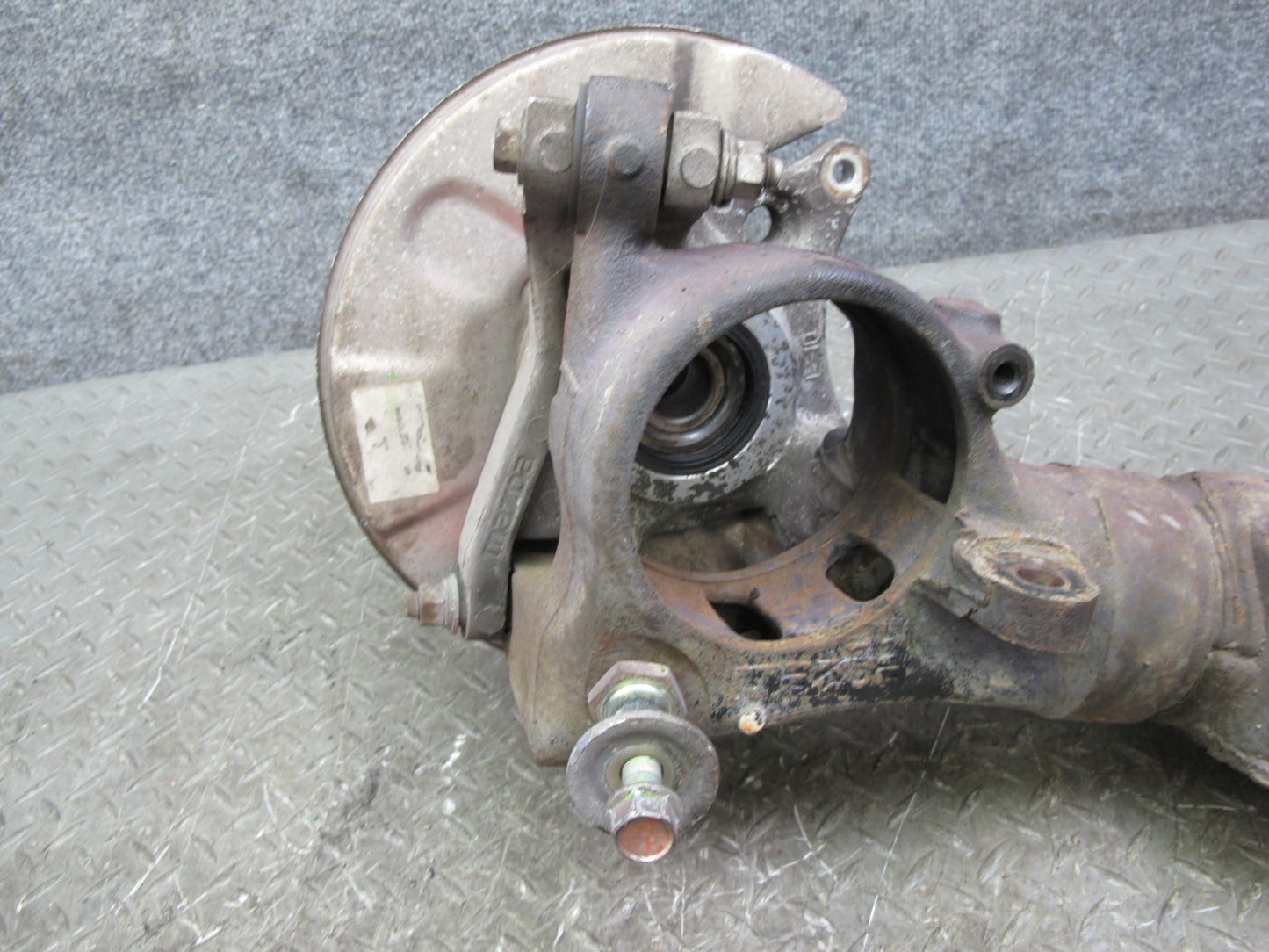 86-91 Mazda RX7 FC3S Rear Left Spindle Knuckle Wheel Hub w Trailing Arm Assy OEM