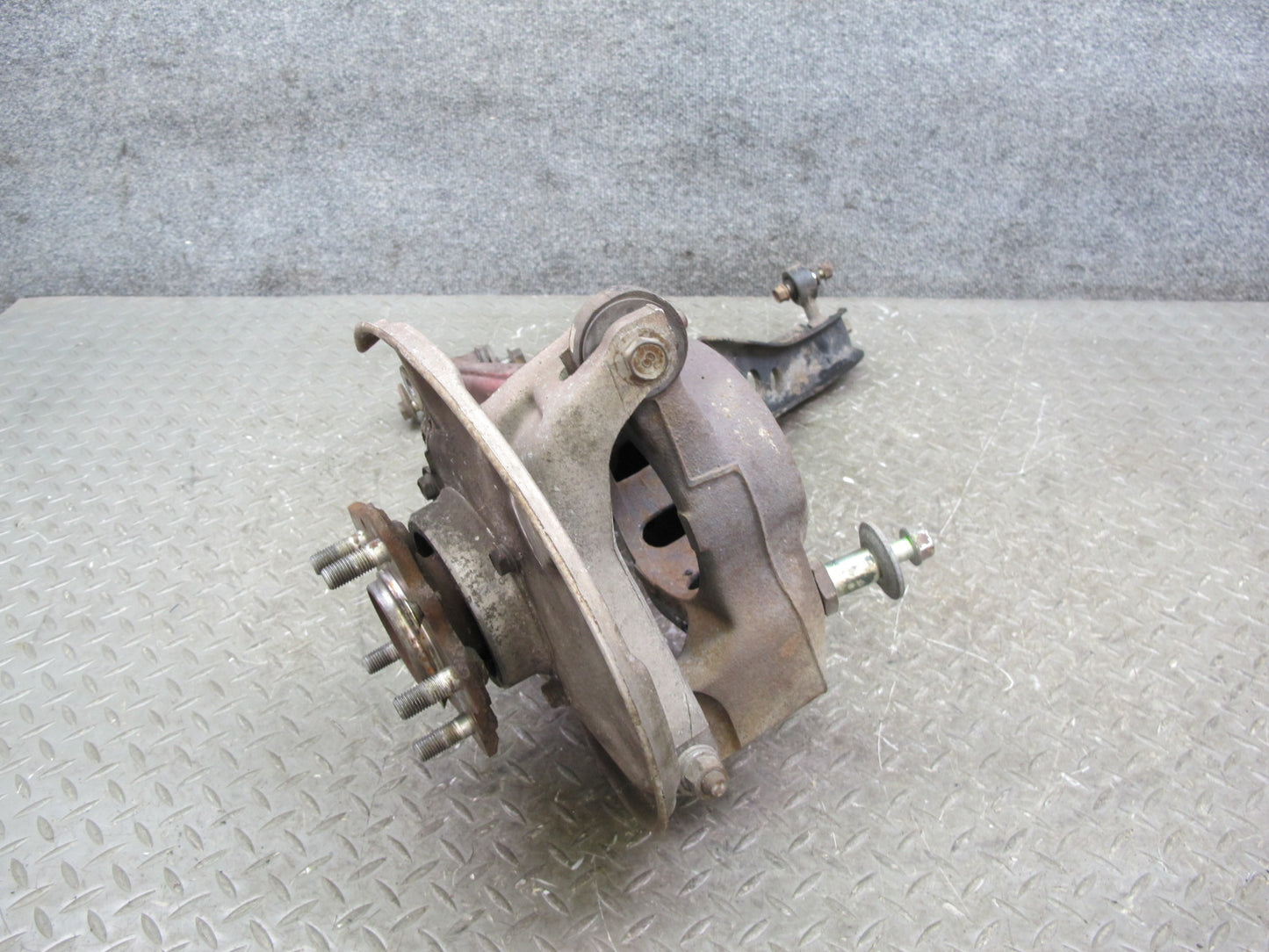 86-91 Mazda RX7 FC3S Rear Left Spindle Knuckle Wheel Hub w Trailing Arm Assy OEM