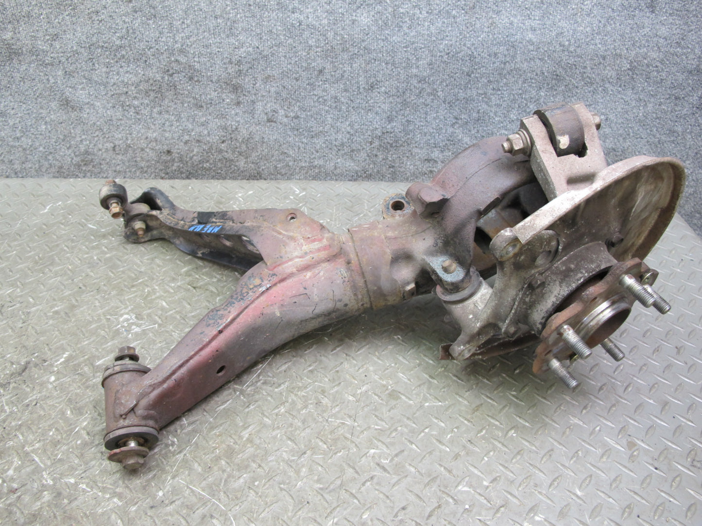 86-91 Mazda RX7 FC3S Rear Left Spindle Knuckle Wheel Hub w Trailing Arm Assy OEM