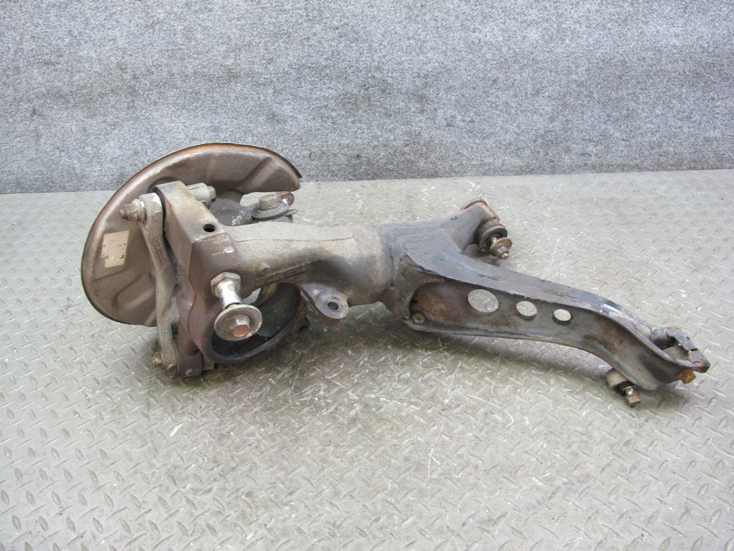 86-91 Mazda RX7 FC3S Rear Right Spindle Knuckle Wheel Hub w Trailing Arm OEM