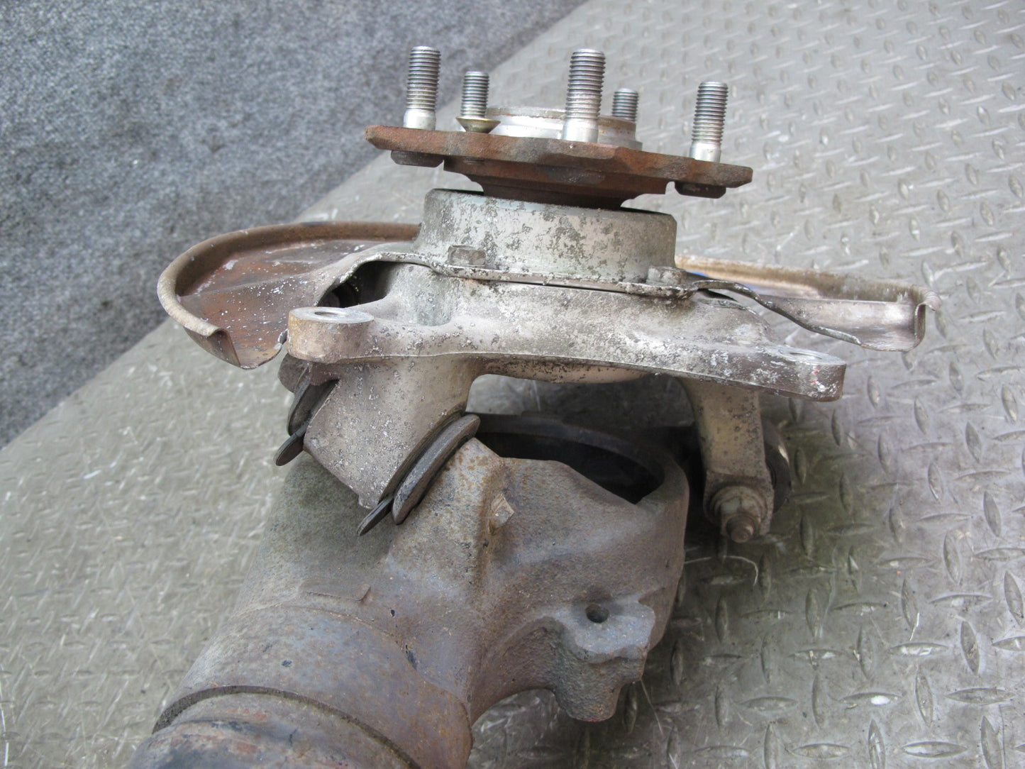 86-91 Mazda RX7 FC3S Rear Right Spindle Knuckle Wheel Hub w Trailing Arm OEM