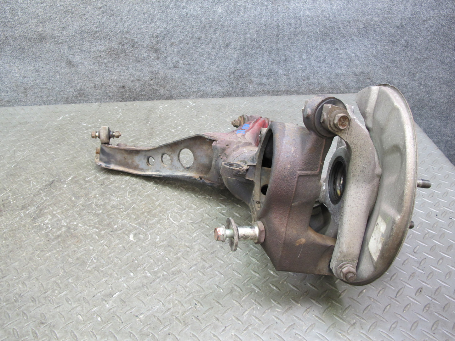 86-91 Mazda RX7 FC3S Rear Right Spindle Knuckle Wheel Hub w Trailing Arm OEM