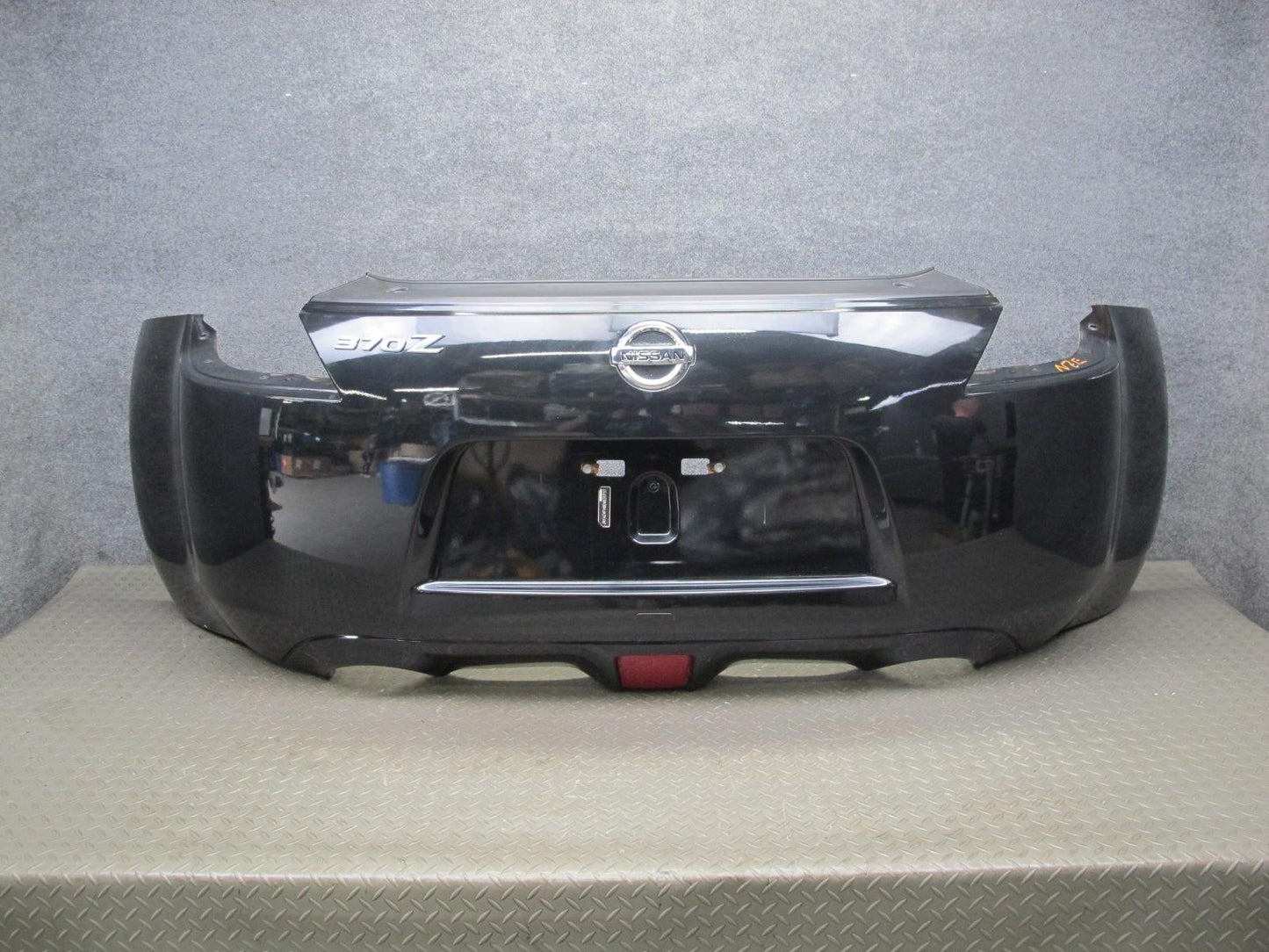 09-20 Nissan Z34 370Z Rear Bumper Cover Panel Black w Emblem OEM