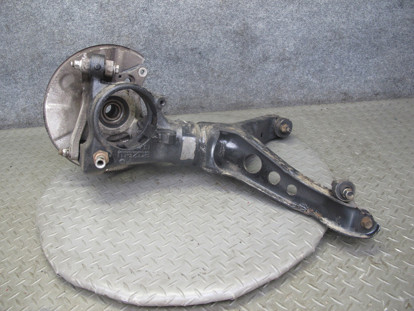 86-91 Mazda RX7 FC3S Rear Left Spindle Knuckle Wheel Hub w Trailing Arm OEM