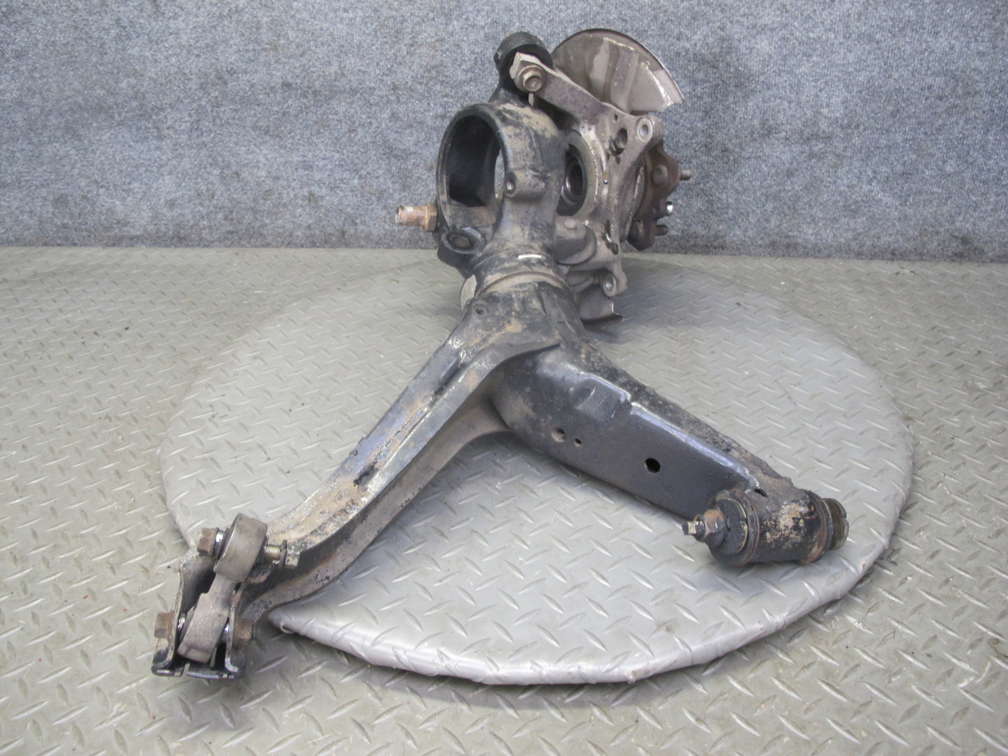 86-91 Mazda RX7 FC3S Rear Left Spindle Knuckle Wheel Hub w Trailing Arm OEM