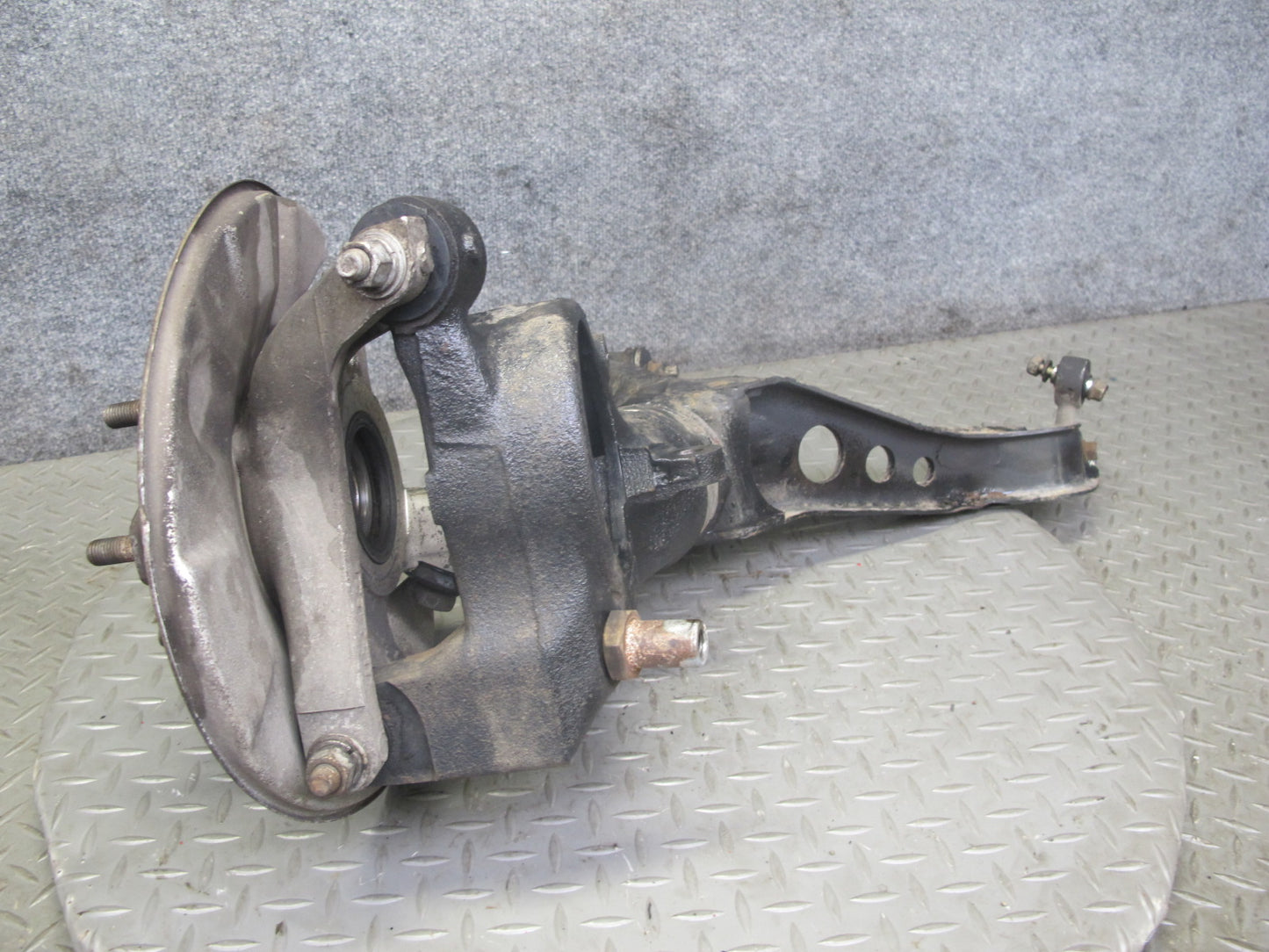 86-91 Mazda RX7 FC3S Rear Left Spindle Knuckle Wheel Hub w Trailing Arm OEM