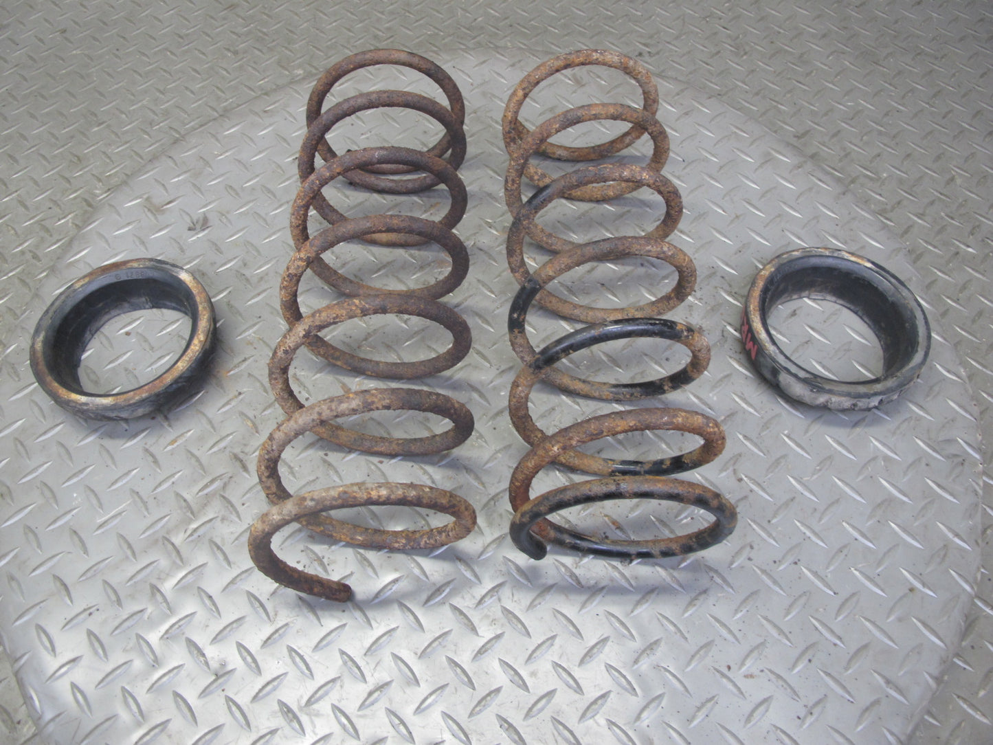 84-85 Mazda RX7 FB Rear Suspension Left & Right Side Coil Spring Set w Pad OEM