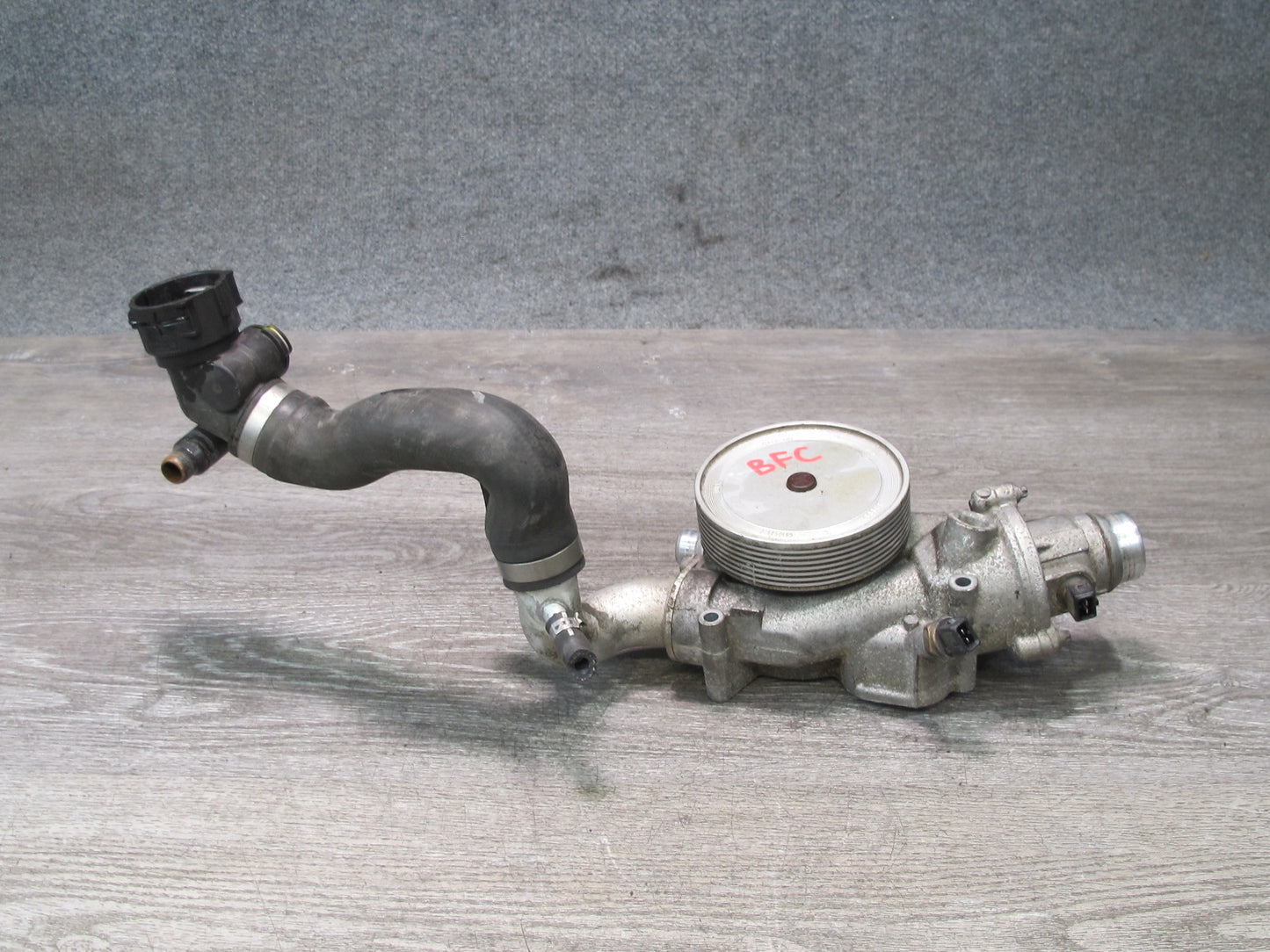 11-16 BMW F12 F10 550i N63 Engine Coolant Water Pump w Thermostat Housing OEM