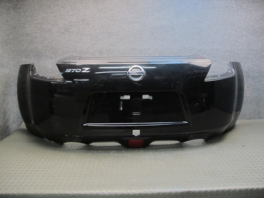 09-20 Nissan Z34 370Z Rear Bumper Cover Panel Black w Emblem OEM