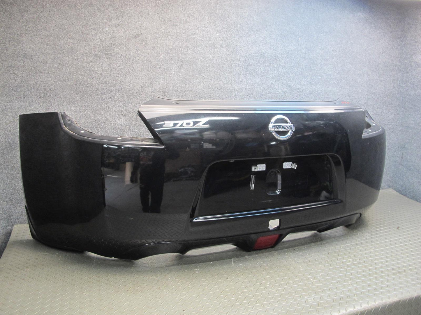 09-20 Nissan Z34 370Z Rear Bumper Cover Panel Black w Emblem OEM