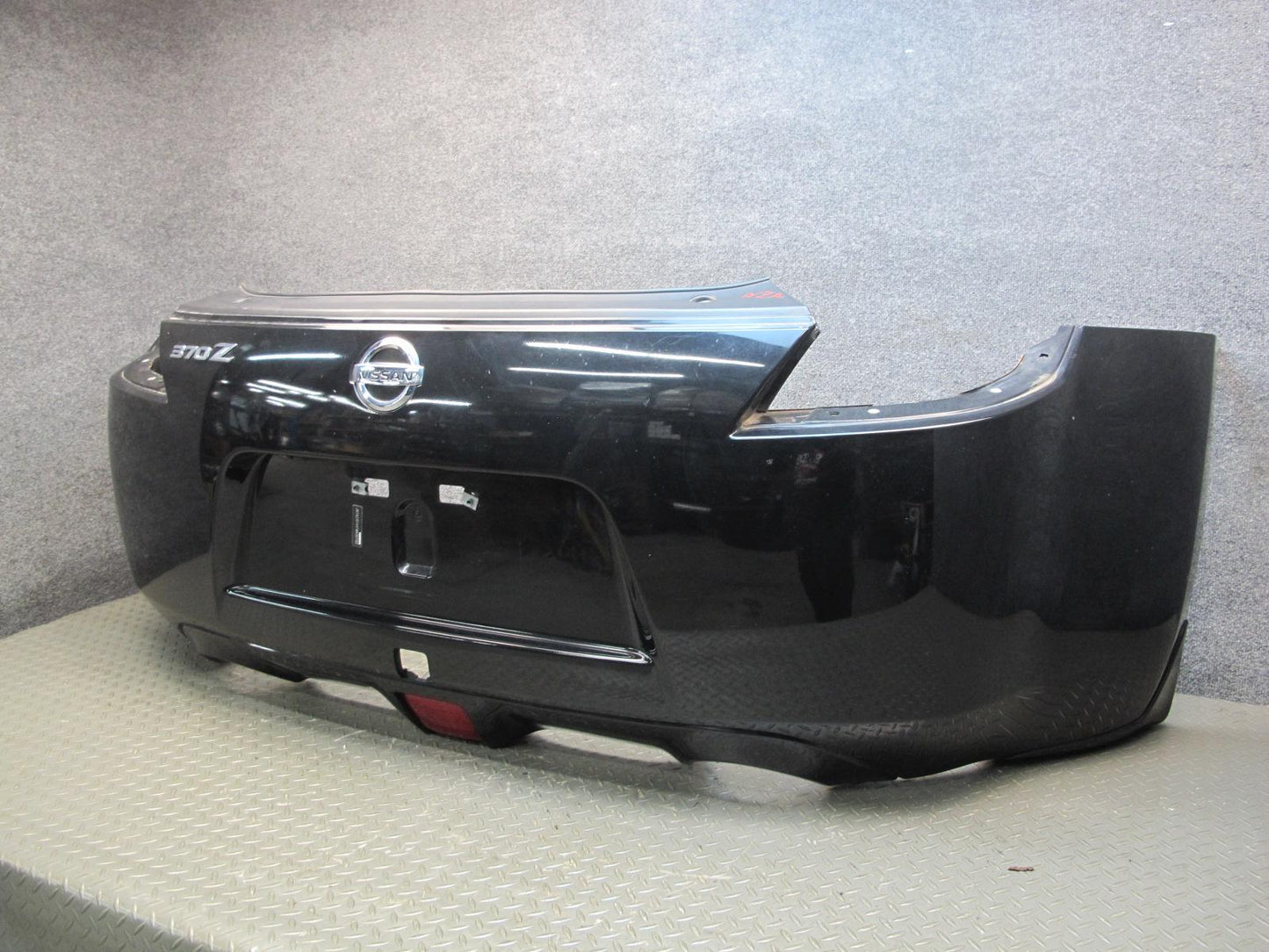 09-20 Nissan Z34 370Z Rear Bumper Cover Panel Black w Emblem OEM