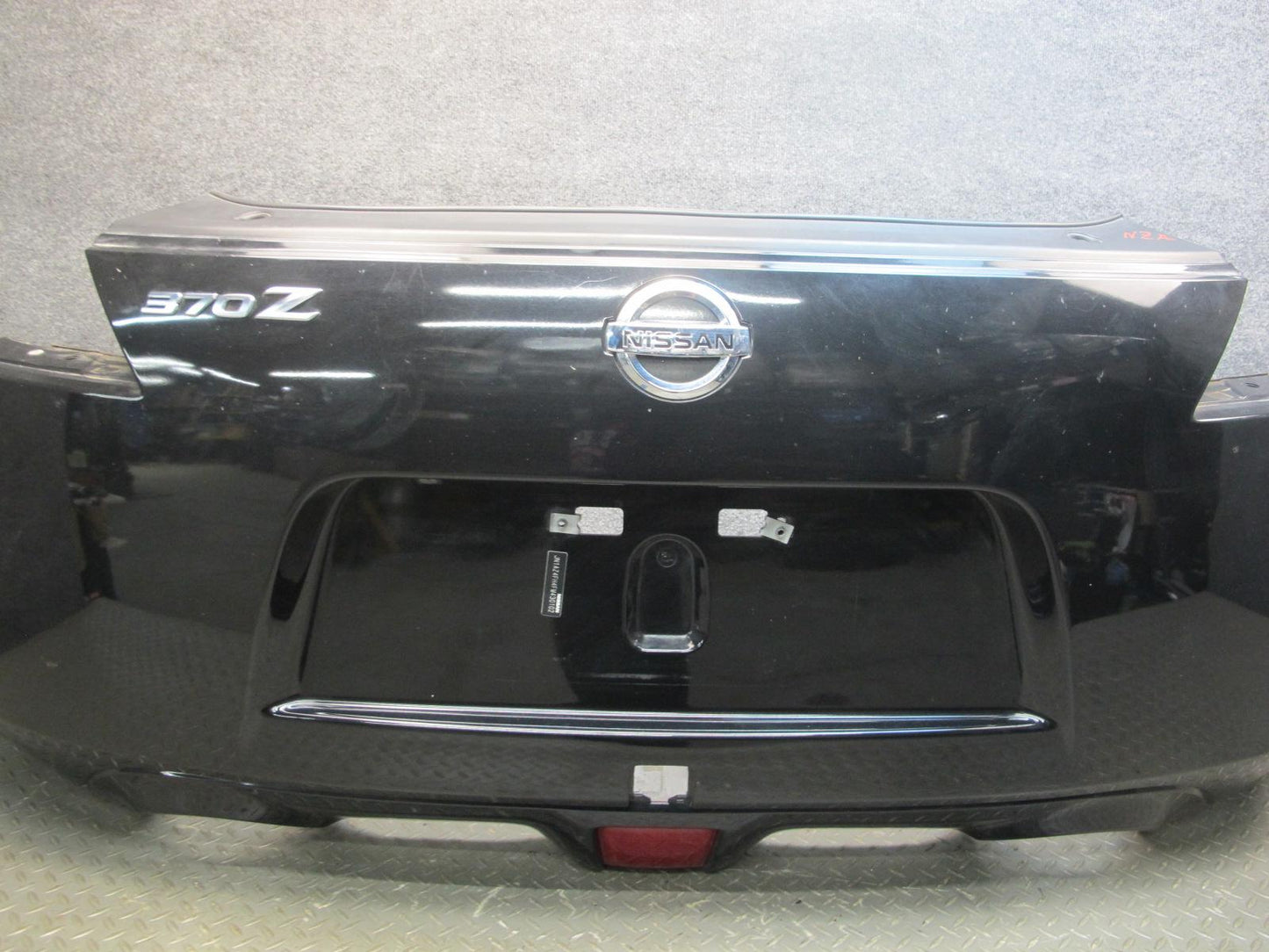 09-20 Nissan Z34 370Z Rear Bumper Cover Panel Black w Emblem OEM