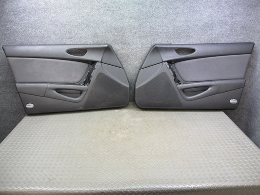 04-08 Mazda RX8 Front Left & Right Side Door Panel Trim Cover Set OEM