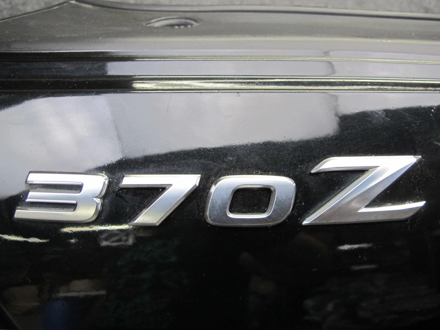 09-20 Nissan Z34 370Z Rear Bumper Cover Panel Black w Emblem OEM