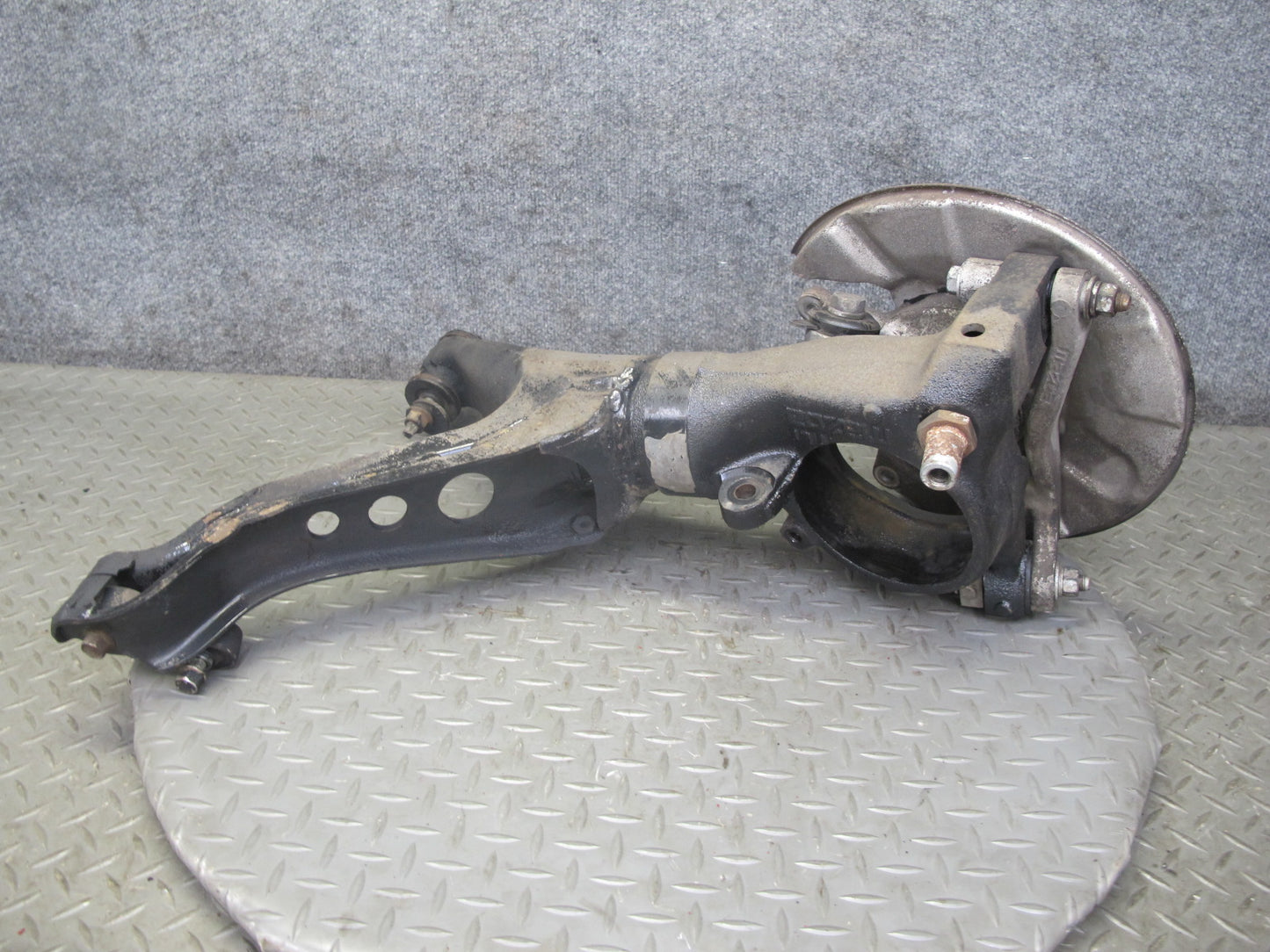 86-91 Mazda RX7 FC3S Rear Left Spindle Knuckle Wheel Hub w Trailing Arm OEM