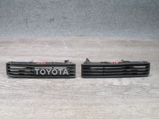 89-92 Toyota Supra MA70L Set of 2 Front Bumper Left & Right Trim Grille Logo OEM