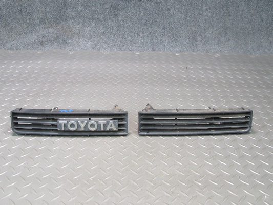 89-92 Toyota Supra MA70L Set of 2 Front Bumper Left & Right Trim Grille Logo OEM