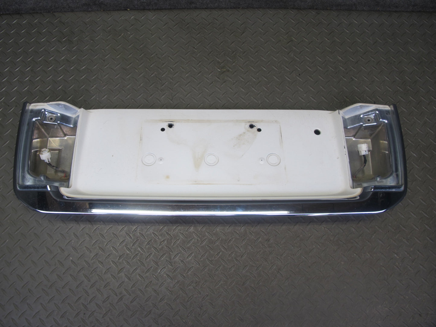 2003-2007 Lexus UZJ100L LX470 Rear Trunk Lid License Plate Molding Panel