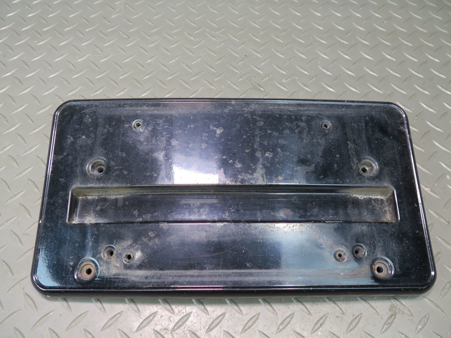 01-06 BMW E46 330ci Front Bumper License Plate Cover Panel Black 7065471 OEM