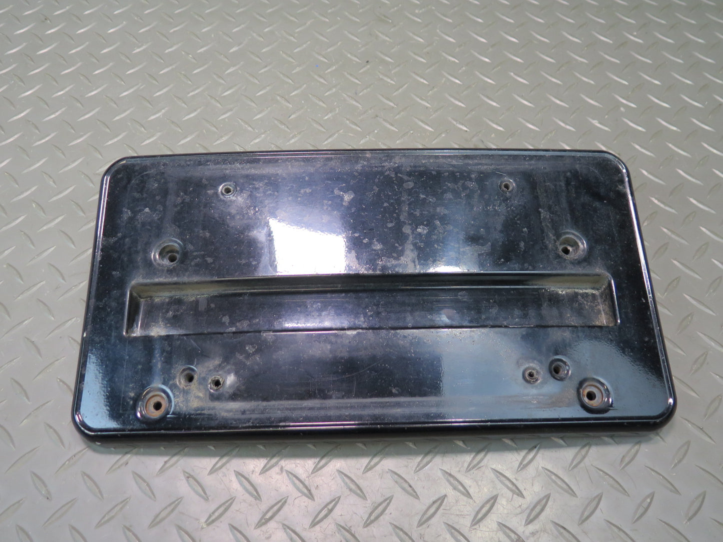 01-06 BMW E46 330ci Front Bumper License Plate Cover Panel Black 7065471 OEM