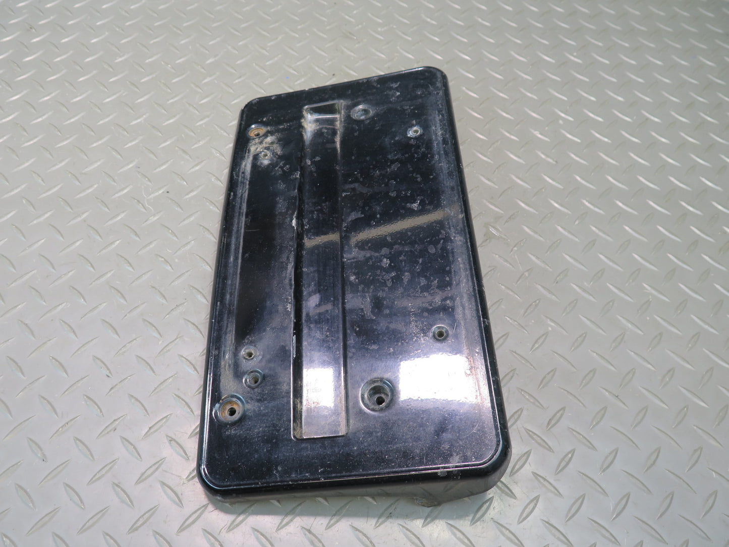 01-06 BMW E46 330ci Front Bumper License Plate Cover Panel Black 7065471 OEM