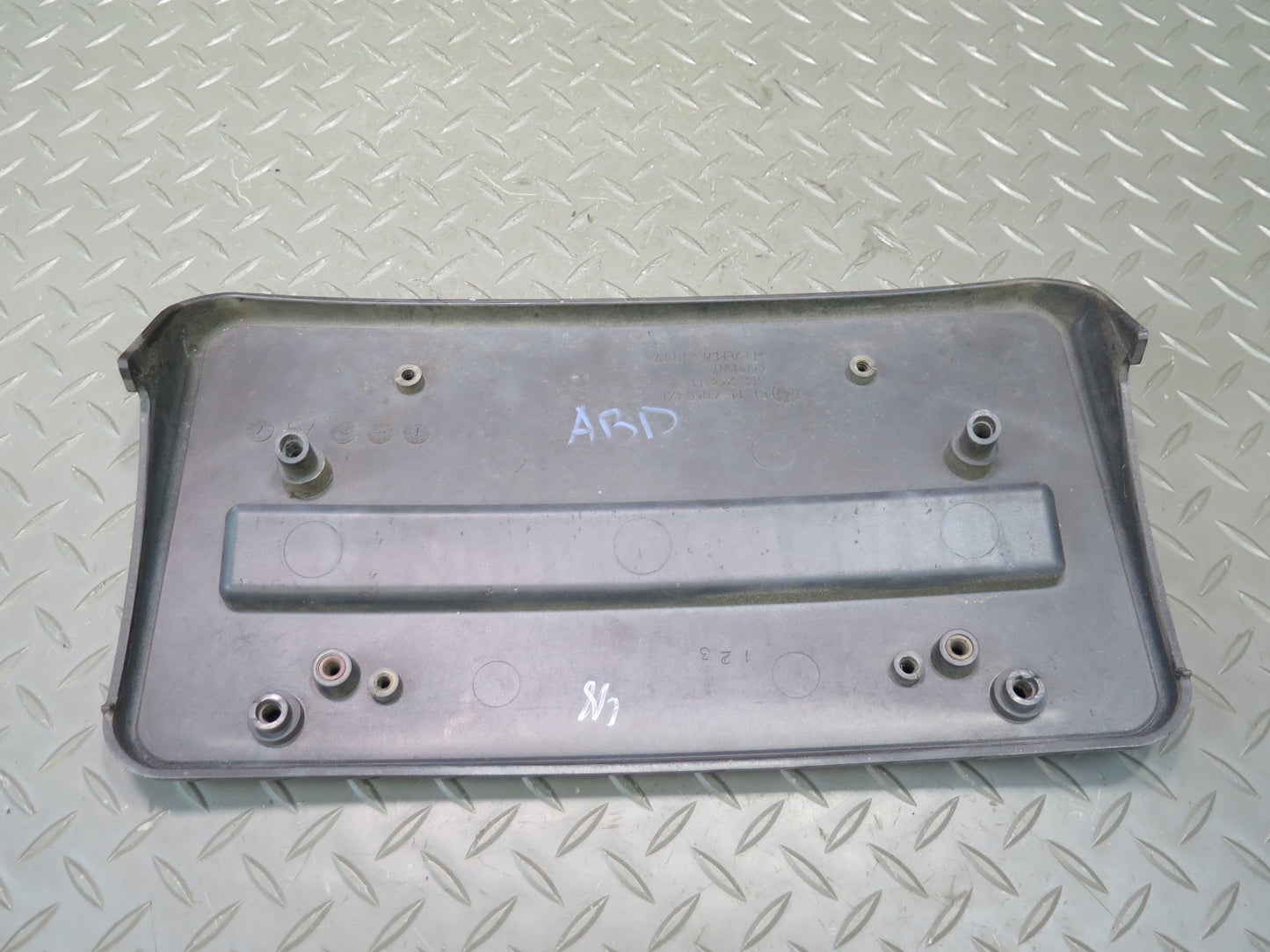 01-06 BMW E46 330ci Front Bumper License Plate Cover Panel Black 7065471 OEM