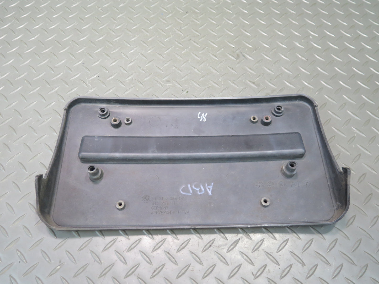01-06 BMW E46 330ci Front Bumper License Plate Cover Panel Black 7065471 OEM