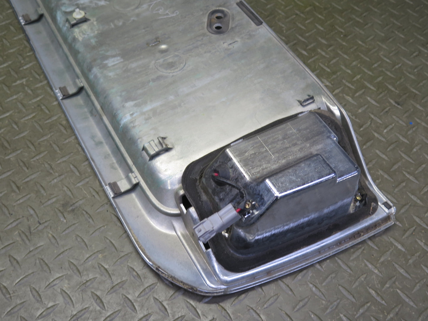 2003-2007 Lexus UZJ100L LX470 Rear Trunk Lid License Plate Molding Panel