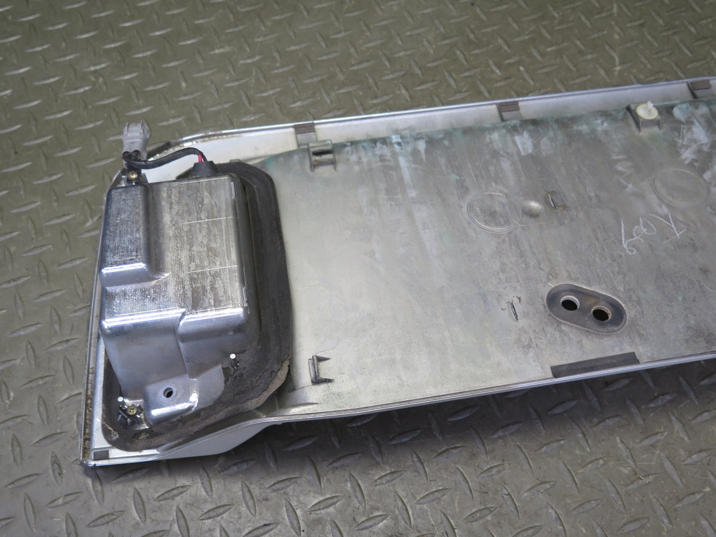 2003-2007 Lexus UZJ100L LX470 Rear Trunk Lid License Plate Molding Panel