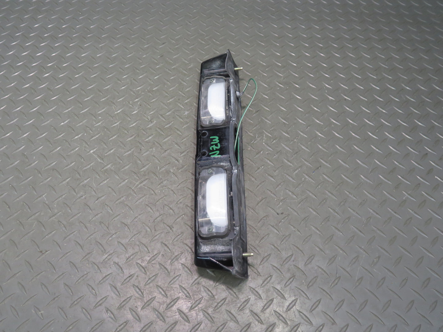 79-83 Datsun 280ZX S130 Rear License Plate Light TAG Trunk Trim Black OEM