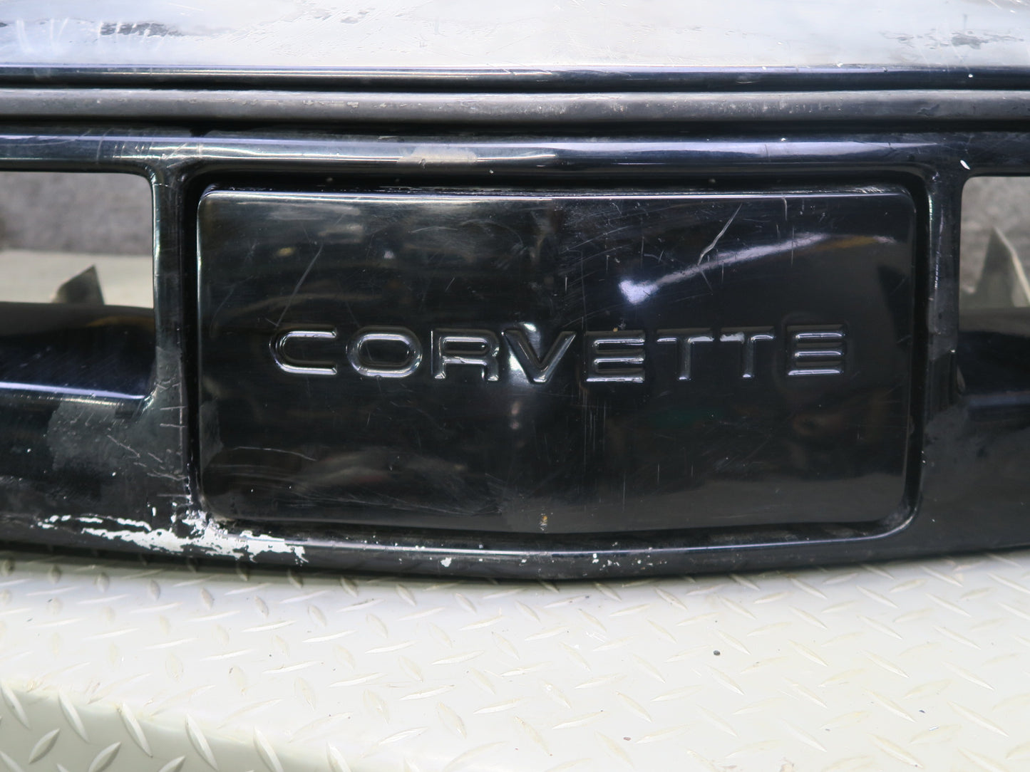 84-90 Chevrolet Corvette C4 Front Bumper Cover w License Plate Cover Black OEM