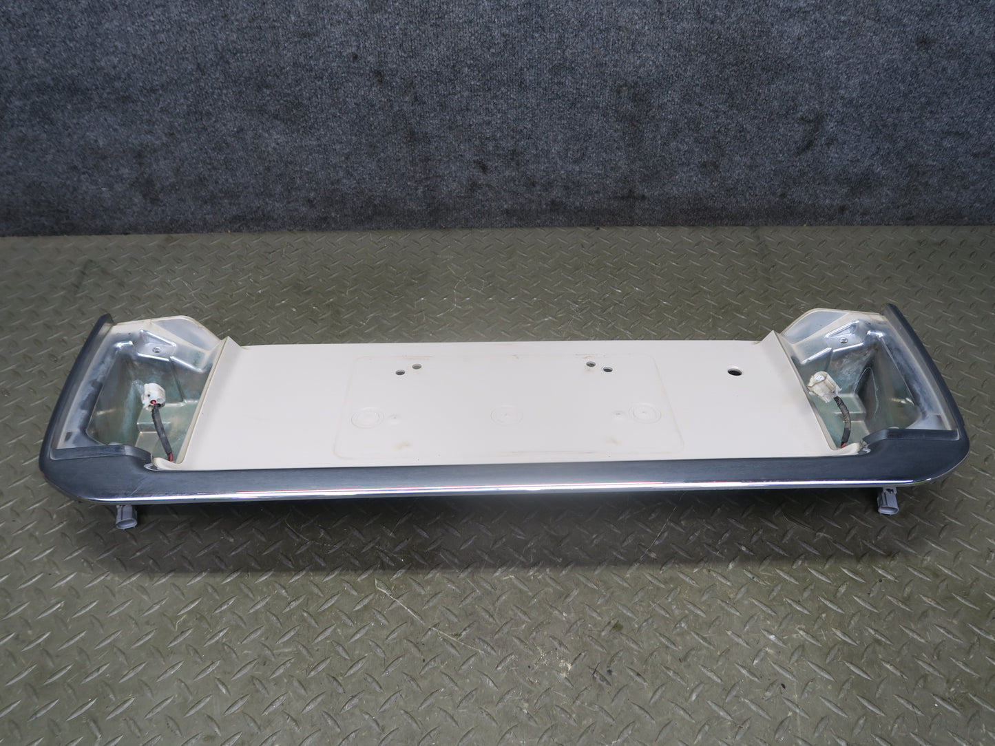 2003-2007 Lexus UZJ100L LX470 Rear Trunk Lid License Plate Molding Panel