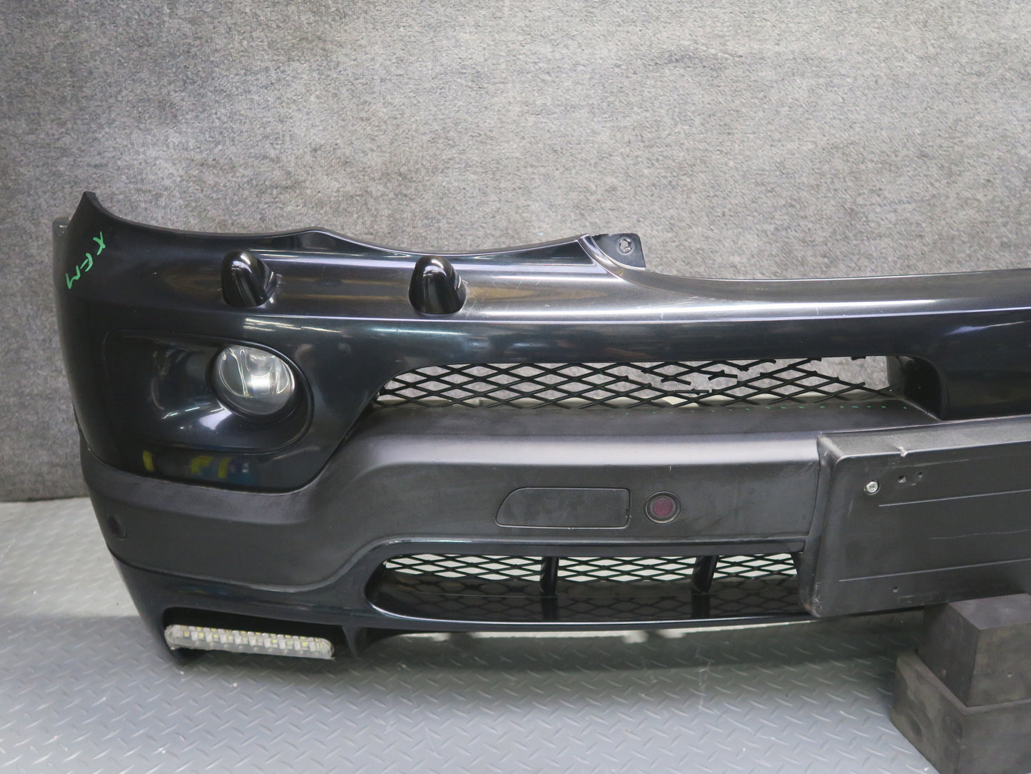 04-06 BMW E53 X5 4.8is Front Bumper Cover Black w Fog Lights PDC Sensors OEM