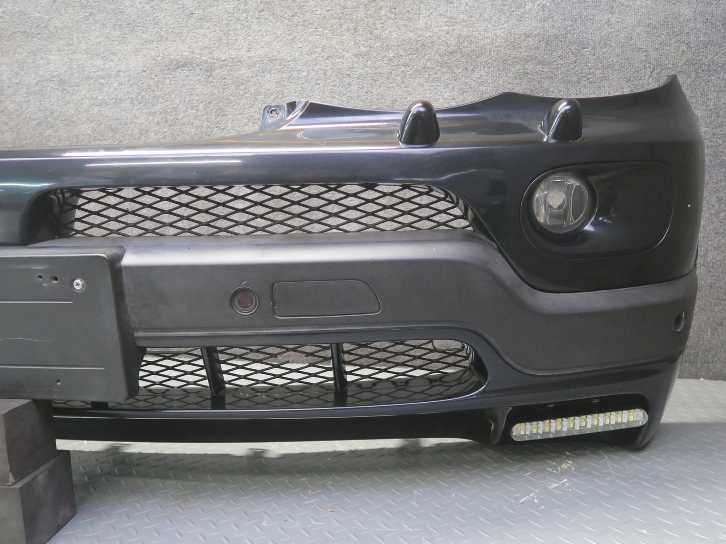 04-06 BMW E53 X5 4.8is Front Bumper Cover Black w Fog Lights PDC Sensors OEM