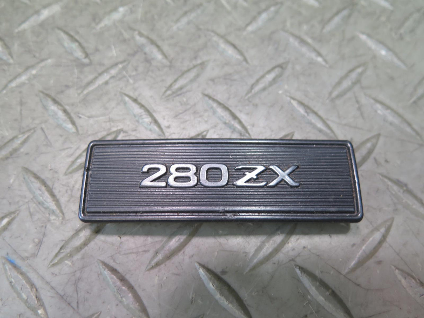 79-83 Datsun Nissan 280ZX S130 NA Center Console Emblem OEM