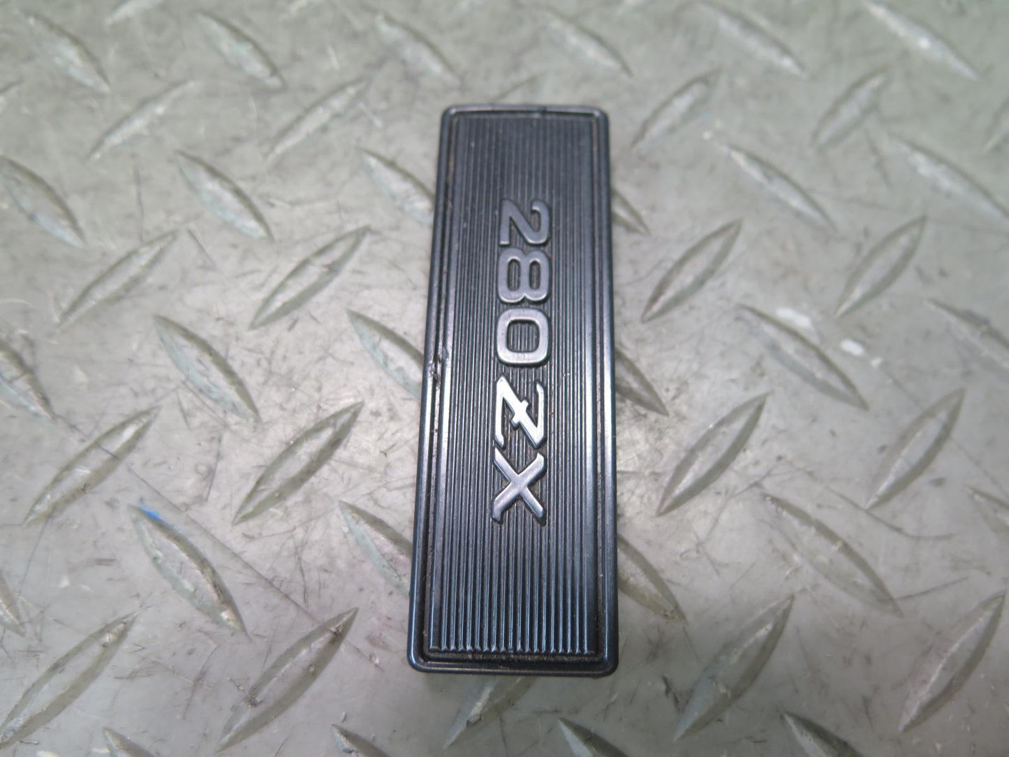 79-83 Datsun Nissan 280ZX S130 NA Center Console Emblem OEM