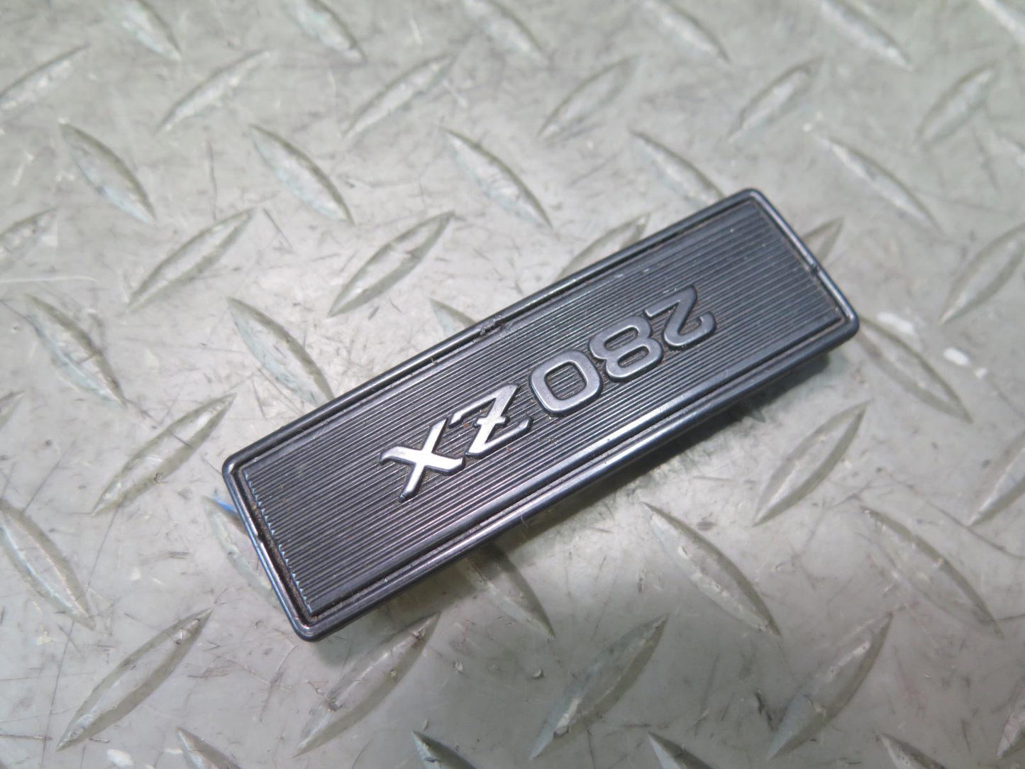 79-83 Datsun Nissan 280ZX S130 NA Center Console Emblem OEM
