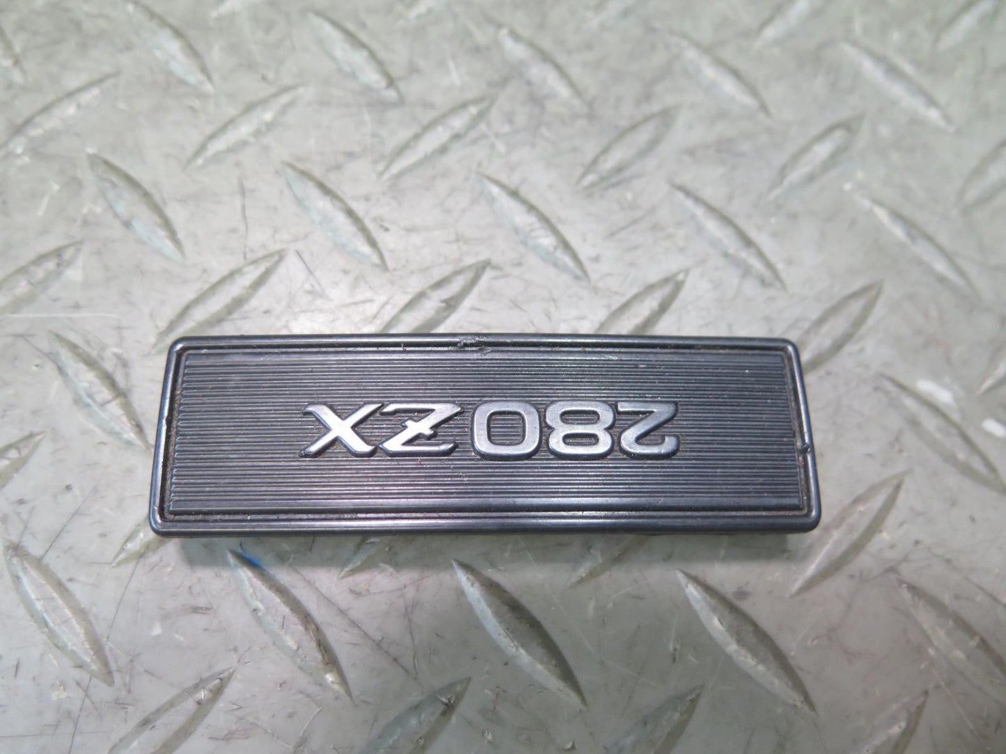 79-83 Datsun Nissan 280ZX S130 NA Center Console Emblem OEM