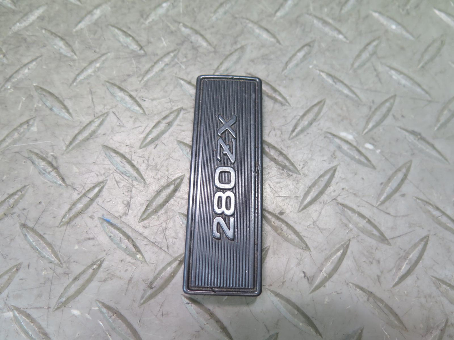79-83 Datsun Nissan 280ZX S130 NA Center Console Emblem OEM