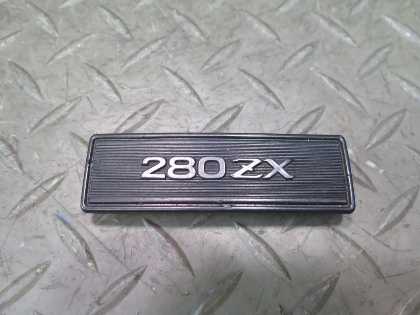 79-83 Datsun Nissan 280ZX S130 NA Center Console Emblem OEM