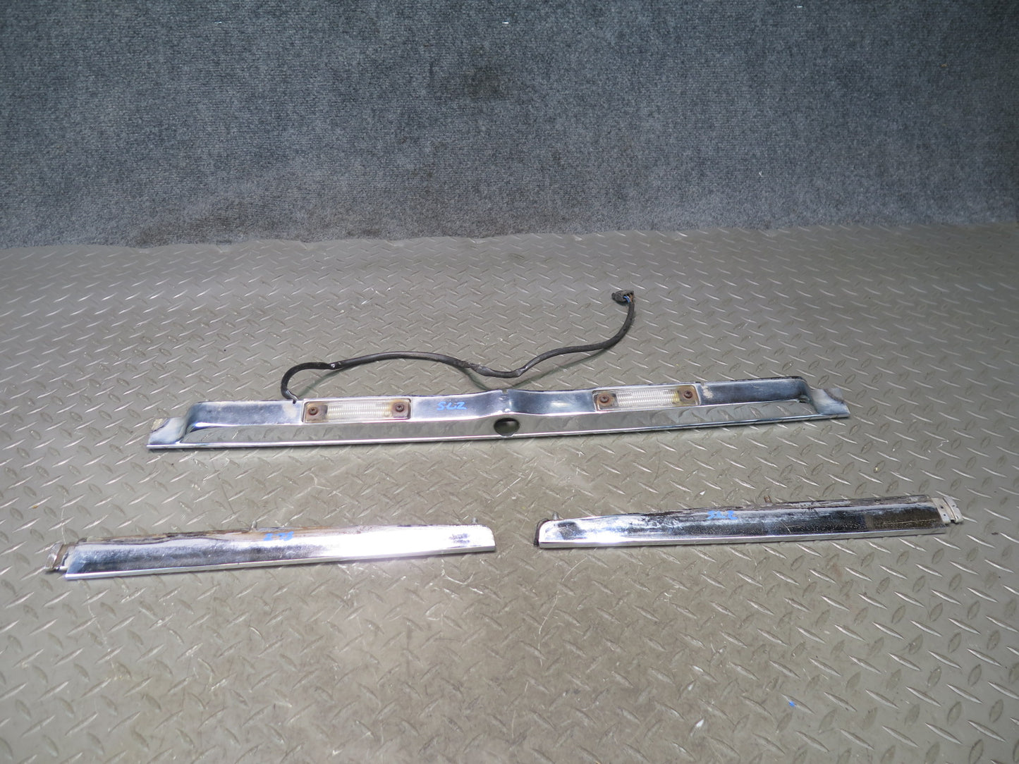 73-89 Mercedes R107 Rear Trunk Lid License Plate Light Chrome Molding Set OEM