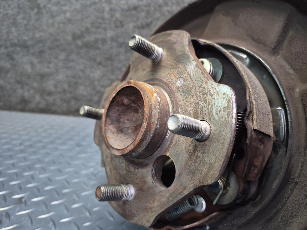 84-88 Toyota Cressida MX73 Rear Left Trailing Arm Wheel Hub Spindle Knuckle OEM