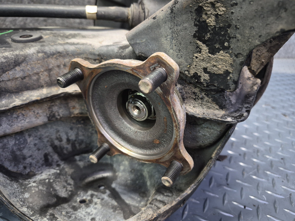 84-88 Toyota Cressida MX73 Rear Left Trailing Arm Wheel Hub Spindle Knuckle OEM