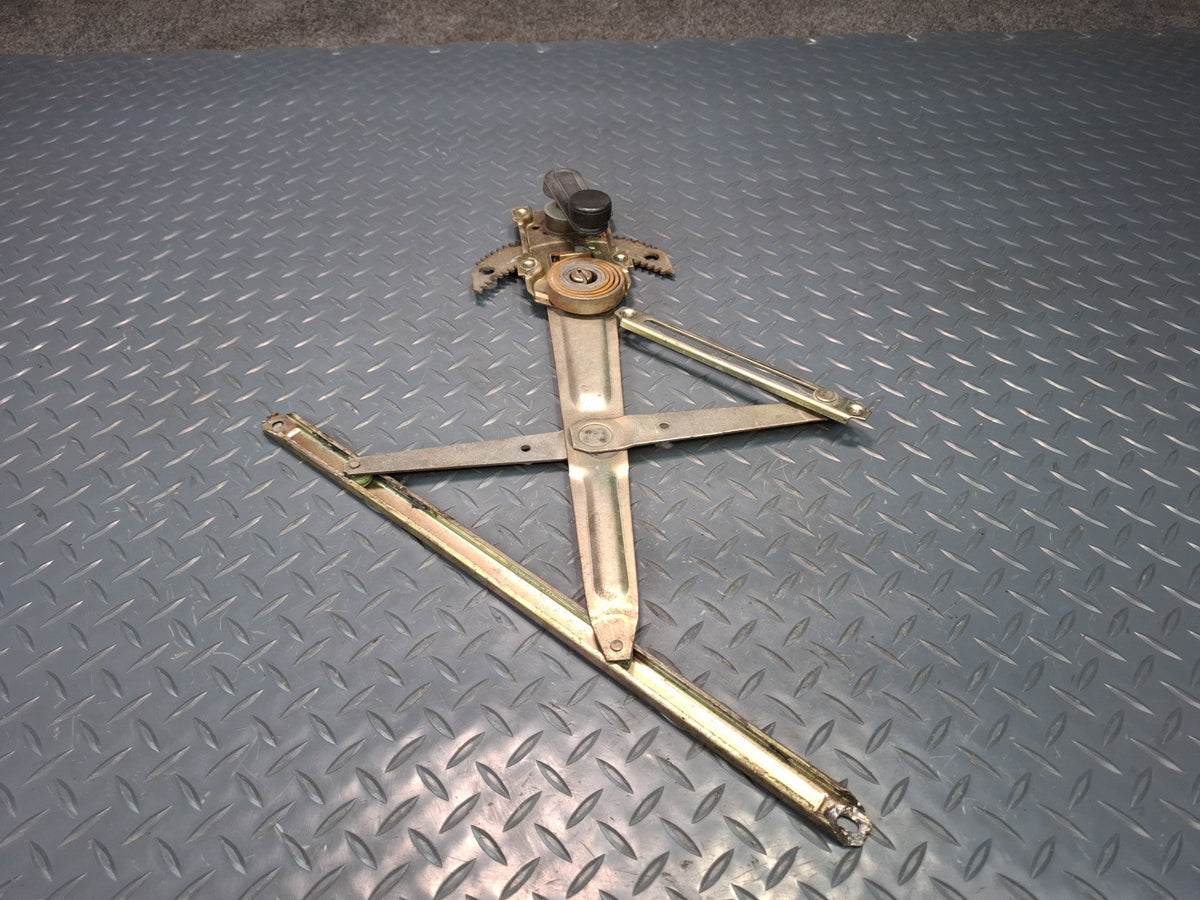 82-85 Toyota Celica RA65 Left Door Manual Window Regulator w Handle OEM