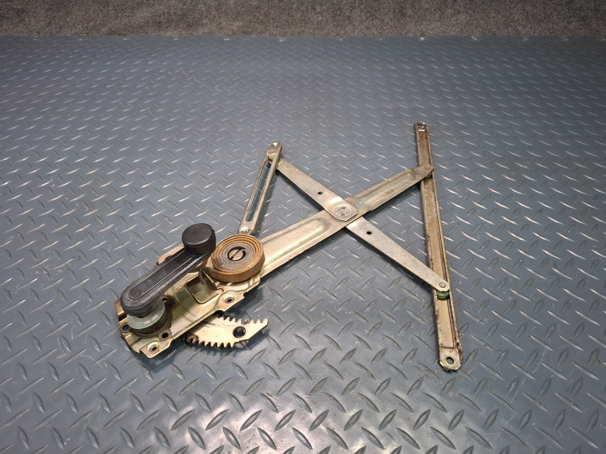 82-85 Toyota Celica RA65 Left Door Manual Window Regulator w Handle OEM