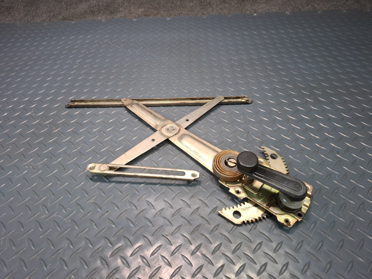 82-85 Toyota Celica RA65 Left Door Manual Window Regulator w Handle OEM