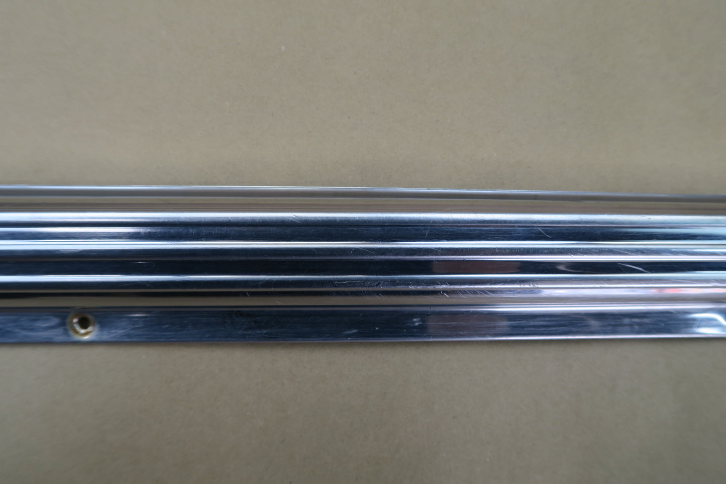 73-85 MERCEDES R107 REAR LEFT CHROME MOLDING COVER OEM