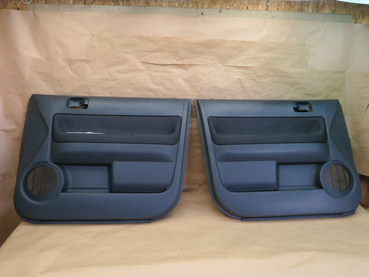 2004-2006 Scion xB Front Left and Right Door Panel Set OEM